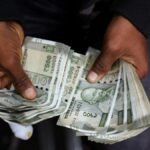 Rupee trades in narrow range against U.S. dollar in early trade
