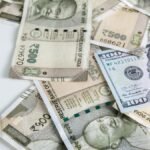 Rupee trades in narrow range against U.S. dollar in early trade
