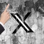 X is nudging users to promote their posts with a pointing hand, and people are confused